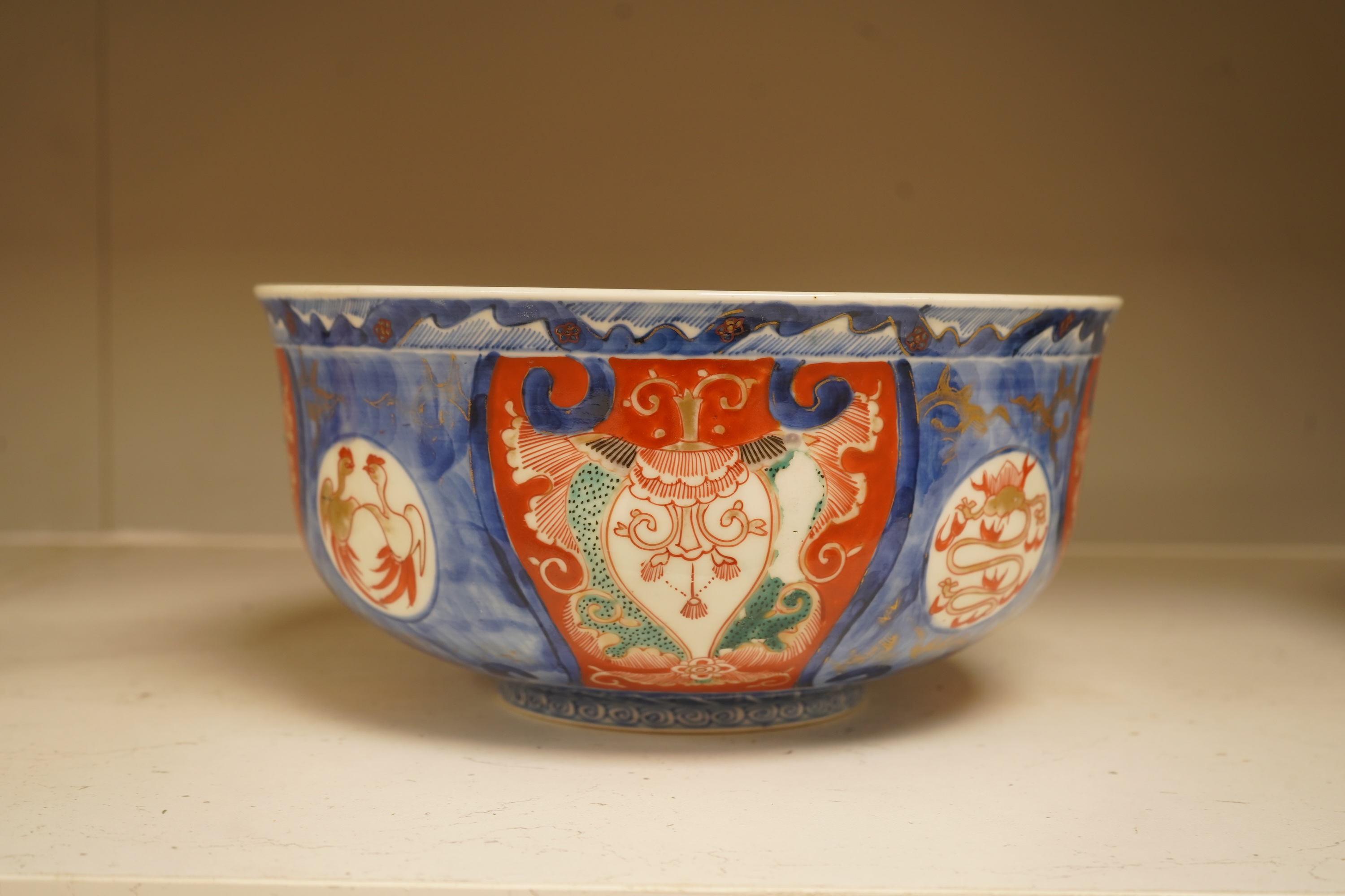 A Japanese Imari bowl and a similar fluted dish, bowl 25cm diameter